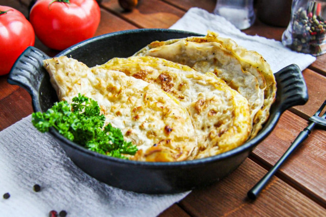 Lavash with egg in a frying pan