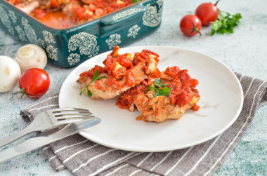 Meat in the oven with tomato cheese mushrooms