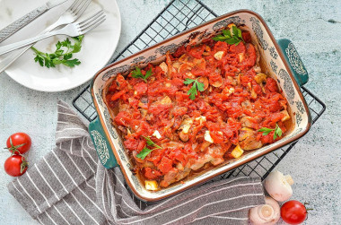 Meat in the oven with tomato cheese mushrooms