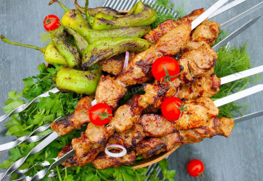 Shish kebab in marinade with mayonnaise and pork onion