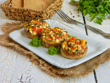 Mushrooms baked in the oven with cheese and garlic whole