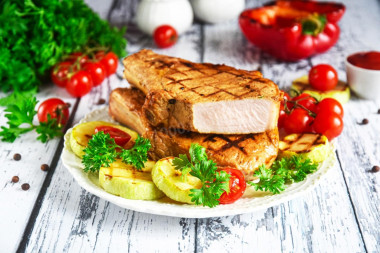 Pork loin in a frying pan on the bone