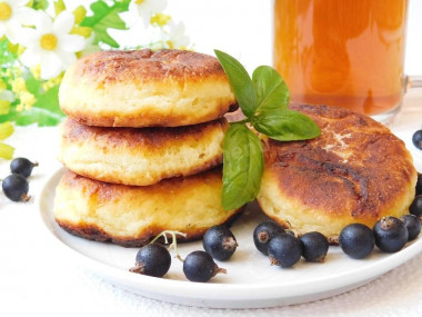 Simple cottage cheese pancakes with egg in a frying pan