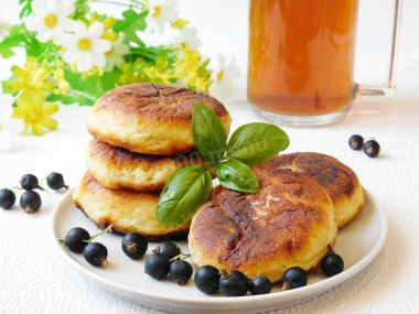 Simple cottage cheese pancakes with egg in a frying pan