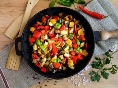 Eggplant stewed with vegetables in a frying pan