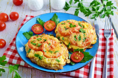 Chops with tomato and cheese in the oven