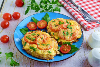 Chops with tomato and cheese in the oven