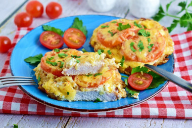 Chops with tomato and cheese in the oven