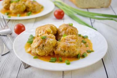 Meatballs with gravy in a frying pan