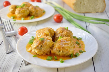 Meatballs with gravy in a frying pan