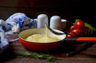 Eggs with cheese in a frying pan