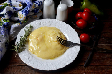 Eggs with cheese in a frying pan