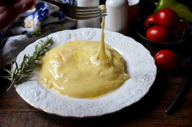 Eggs with cheese in a frying pan