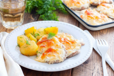 Pork chop in the oven with cheese