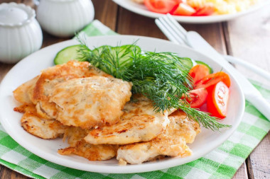 Chicken fillet in batter in a frying pan