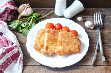 Fish in batter in a frying pan