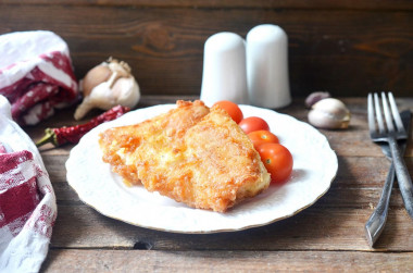 Fish in batter in a frying pan