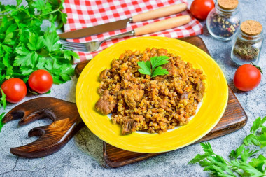 Merchant-style buckwheat with pork in a frying pan