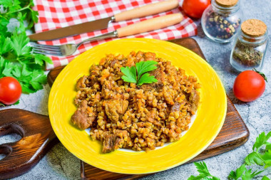 Merchant-style buckwheat with pork in a frying pan