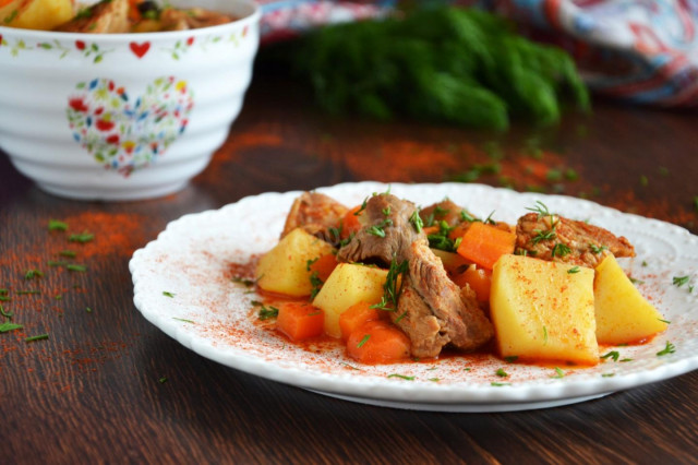 Potatoes with meat stewed in a saucepan