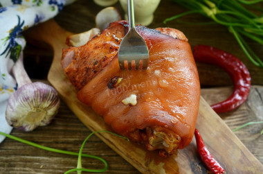 Pork knuckle in the sleeve baked in the oven