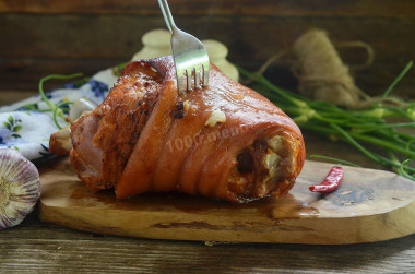 Pork knuckle in the sleeve baked in the oven