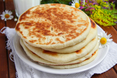 Tortillas on milk in a frying pan