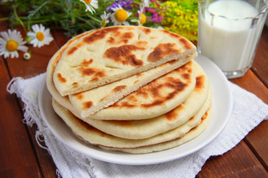 Tortillas on milk in a frying pan