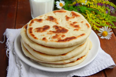 Tortillas on milk in a frying pan