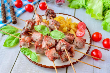 Barbecue on a baking sheet in the oven made of pork