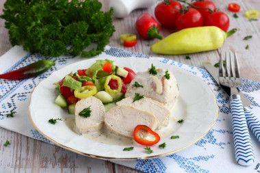 Stewed chicken breast in a frying pan