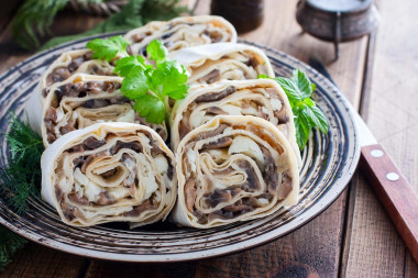 Pita bread with mushrooms and melted cheese