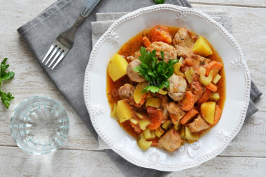 Meat with vegetables in a cauldron