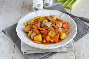 Meat with vegetables in a cauldron