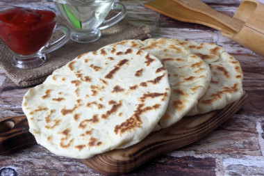 Tortillas with potatoes in a frying pan