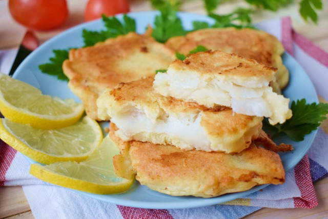 Cod fillet in batter in a frying pan