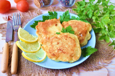 Cod fillet in batter in a frying pan