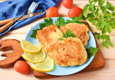 Cod fillet in batter in a frying pan