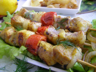 Pork kebab in foil in the oven is soft and juicy