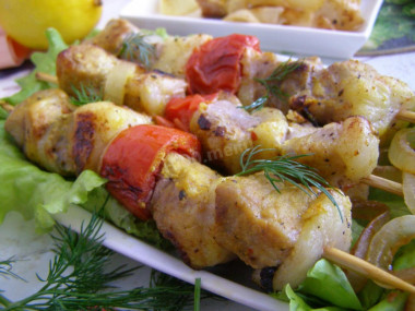 Pork kebab in foil in the oven is soft and juicy