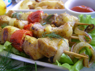 Pork kebab in foil in the oven is soft and juicy