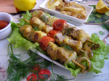 Pork kebab in foil in the oven is soft and juicy