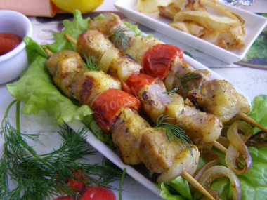 Pork kebab in foil in the oven is soft and juicy