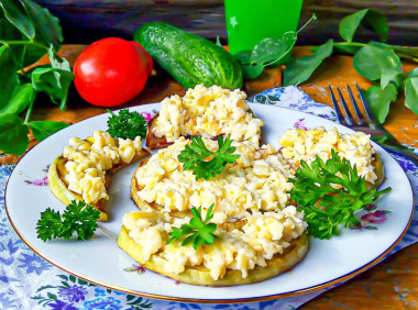 Zucchini with cheese in a frying pan with garlic