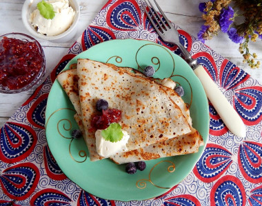 Pancakes on water with eggs thin with holes