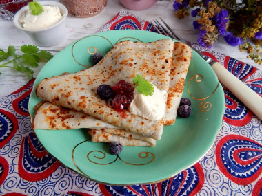 Pancakes on water with eggs thin with holes