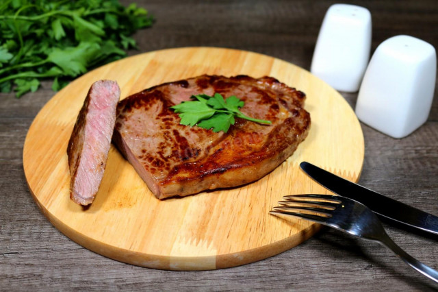 Marbled beef steak in a frying pan