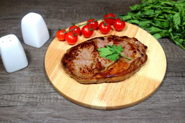 Marbled beef steak in a frying pan