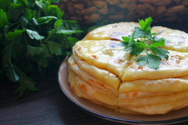 Hychines with potatoes and cheese in a frying pan